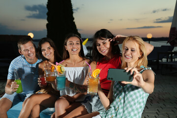 Poster - Happy people taking selfie at pool party in evening