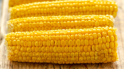 Wall Mural - Sweet corn, ready to eat on wooden board