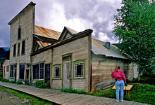 Visitor To Old Gold Rush Era (late 1890’s) Buildings Of Dawson City, Yukon Territory, Canada