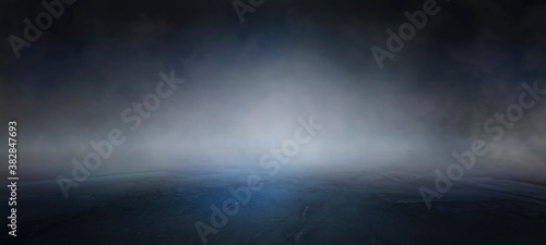 Fotografía Dark empty street with smoke float up on dark background and spotlights on concrete floor, nightclub entertainment