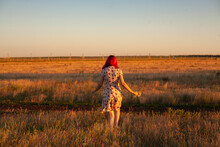 Woman In A Field