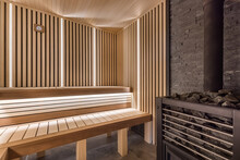 Modern Wooden Sauna Interior With Elegant Lighting And Electric Heater