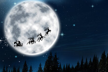 Magic Christmas Eve. Santa With Reindeers Flying In Sky On Full Moon Night