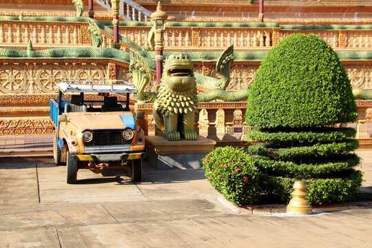Old small pickup truck stands at Buddhist Temple 2