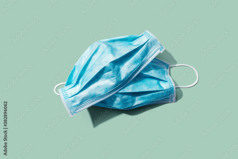 Blue surgical masks overhead view - flat lay - obrazy, fototapety, plakaty 