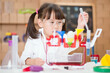 © M-image - young  girl  play science experiments for homeschooling