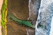 © AmazingAerialAgency - Aerial view of rocks and pool formation close to Praia do Forte and Praia do Lord, Brazil.