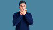 © Krakenimages.com - Young handsome man wearing casual clothes shocked covering mouth with hands for mistake. secret concept.