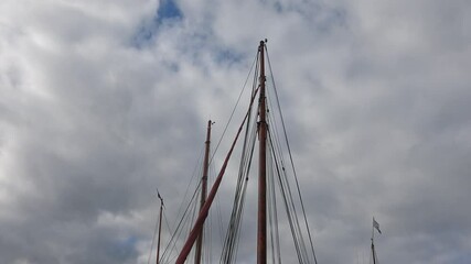 Wall Mural - Sailing ship mast against the cloudy sky on sailing boats with rigging details