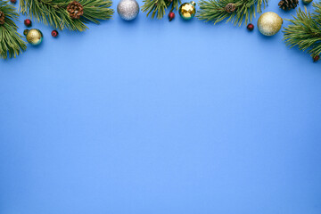 blue christmas background with fir branches and decorations