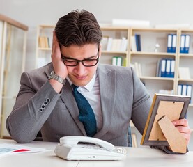 Businessman looking at the picture frame