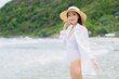 © siraphol - Portrait beautiful young asian woman relax smile around beach sea ocean