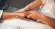 © Strelciuc - Caucasian spa worker massaging client's hand with special lotion during a hand massage session at spa salon
