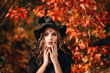 Close-up face of woman wearing witch hat on head for halloween