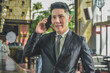 © Suriyo - Asian man using mobile phone, Businessman call cell phone