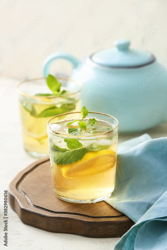 Glasses of tasty cold ice tea on table