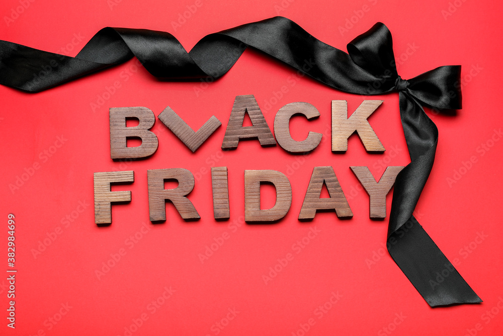 Text BLACK FRIDAY on color background