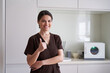 © Yakobchuk Olena - Happy young female employee standing in beauty clinic
