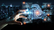 © sdecoret - Businessman hand holding and touching wireframe holographic digital projection of an engine 3D rendering