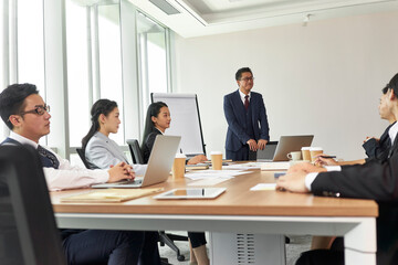 Wall Mural - team of asian business people meeting in office