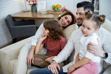 Wall Mural - Family hugging on the couch