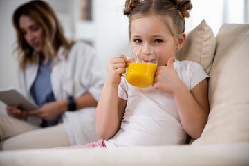 Wall Mural - Child enjoying a delicious beverage