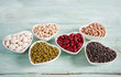 assortment of beans on wooden surface