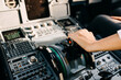 © Bostan Natalia - Pilot hand on airplane engine controller in cockpit.