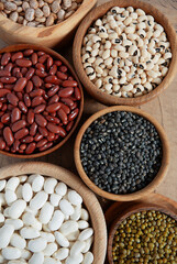 Poster - assortment of beans on wooden surface