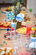 Children's party, lots of sweets, candy, cookies and fruit, colorful table