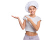 Happy teenage girl wearing chef hat with emotions showing signs with hands, isolated on a white background.