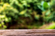 © Yuwarin - Empty old wooden top on mountain blur background image for product display montage.
