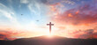 Christian wooden cross on the mountain  sunset background