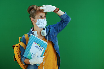 Wall Mural - modern student in shirt against green looking at copy space