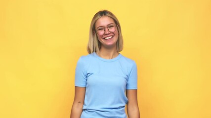 Wall Mural - Young blonde caucasian woman relaxed and happy laughing, neck stretched showing teeth