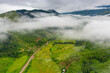 © Sunday Stock - Aerial view over valley surrounded by mountains and covered with dense ground fog and mist High peaks wonderful morning sunrise natural Landscape. Sapan village, nan province, Thailand.