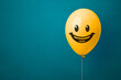 © AdriaVidal - Stock photo of a yellow balloon with smiling face on a blue background