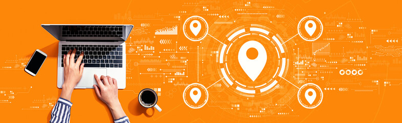 Map pin concept with person using a laptop computer