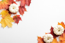 Autumn Composition. Frame Made Of Colorful Maple Leaves And Pumpkin On White Background. Flat Lay, Top View. Autumn Fall, Harvest, Thanksgiving Concept.