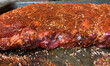 Close up of baby back ribs coated with a spice rub, visually appealing, macro