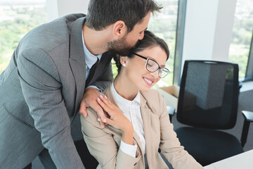 Business couple romancing at office