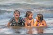 Summer kids on a wild beach