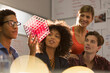 © Tom Merton/Caia Image - Creative young business people examining prototype in meeting