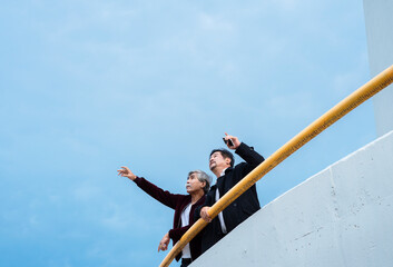 Wall Mural - Two old elderly senior business man outdoors in city.