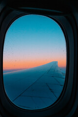 Airplane window sunset sunrise clouds 