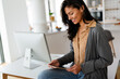 © NDABCREATIVITY - Beautiful young woman with digital tablet at home