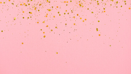 Wall Mural - Gold glitter on pink background. Holiday abstract