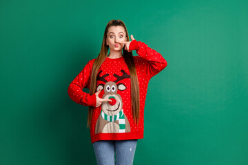 Wall Mural - Portrait of her she nice-looking attractive pretty comic girlish funky cheery long-haired girl having fun touching nose self deer print fooling pout lips isolated over green color background