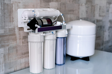 Household filtration system. Water treatment concept. Use of water filters at home. Special technic for home.