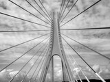 Fototapeta Londyn - The transmission of a modern bridge against the sky.